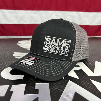 SAME ASSHOLE DIFFERENT DAY Hat